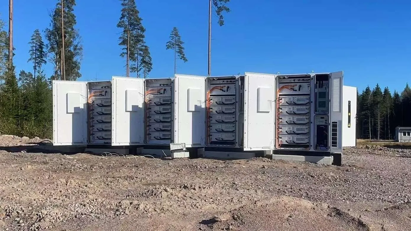 Open BESS cabinets showing battery modules and power converter