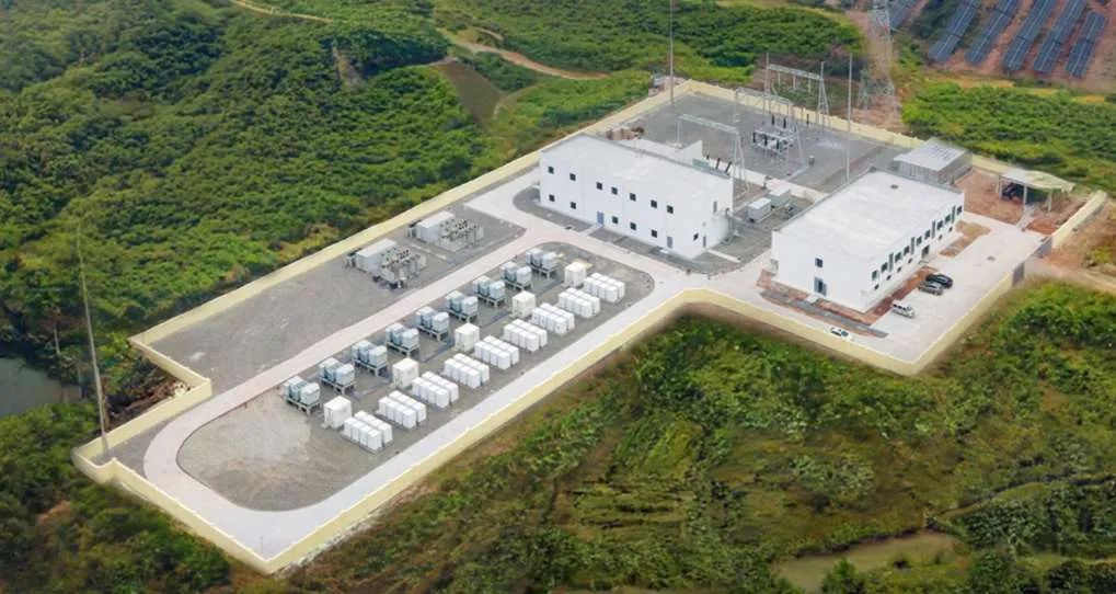 Aerial view of a group BESS plant next to a solar farm